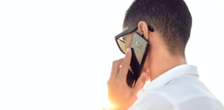 A picture of a customer on the phone with a customer service representative from Veritas Global Protection.